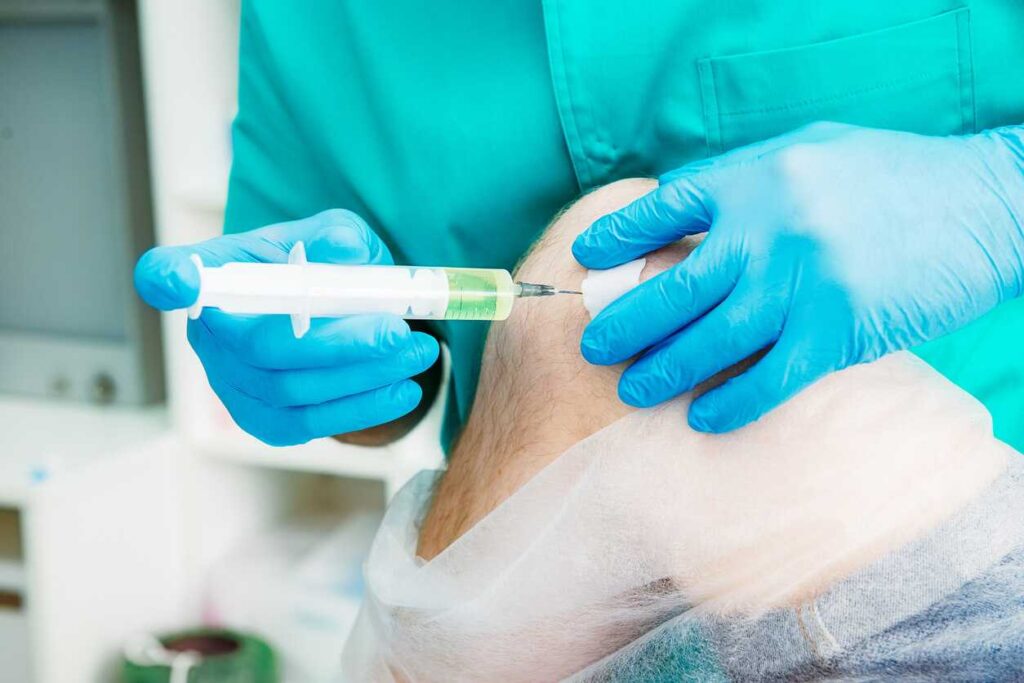 PRP injection for knee; image of a doctor inserting an injection into a patient’s knee.