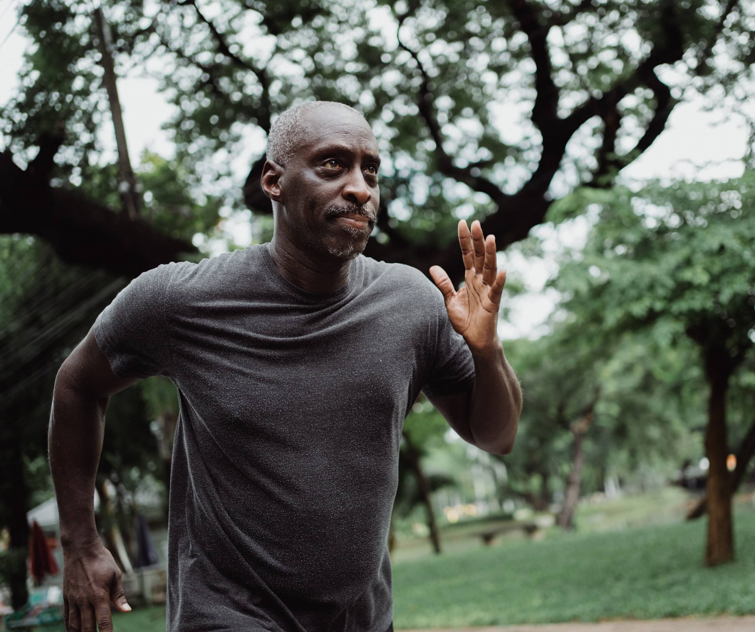 ozone therapy atlanta, Image of a man wearing a dark gray tshirt jogging in the park.