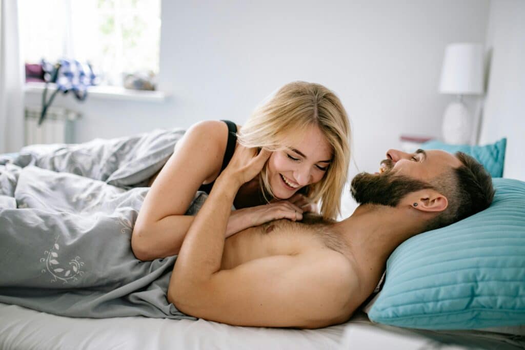 what is the latest treatment for erectile dysfunction, Image of a happy couple in bed together.