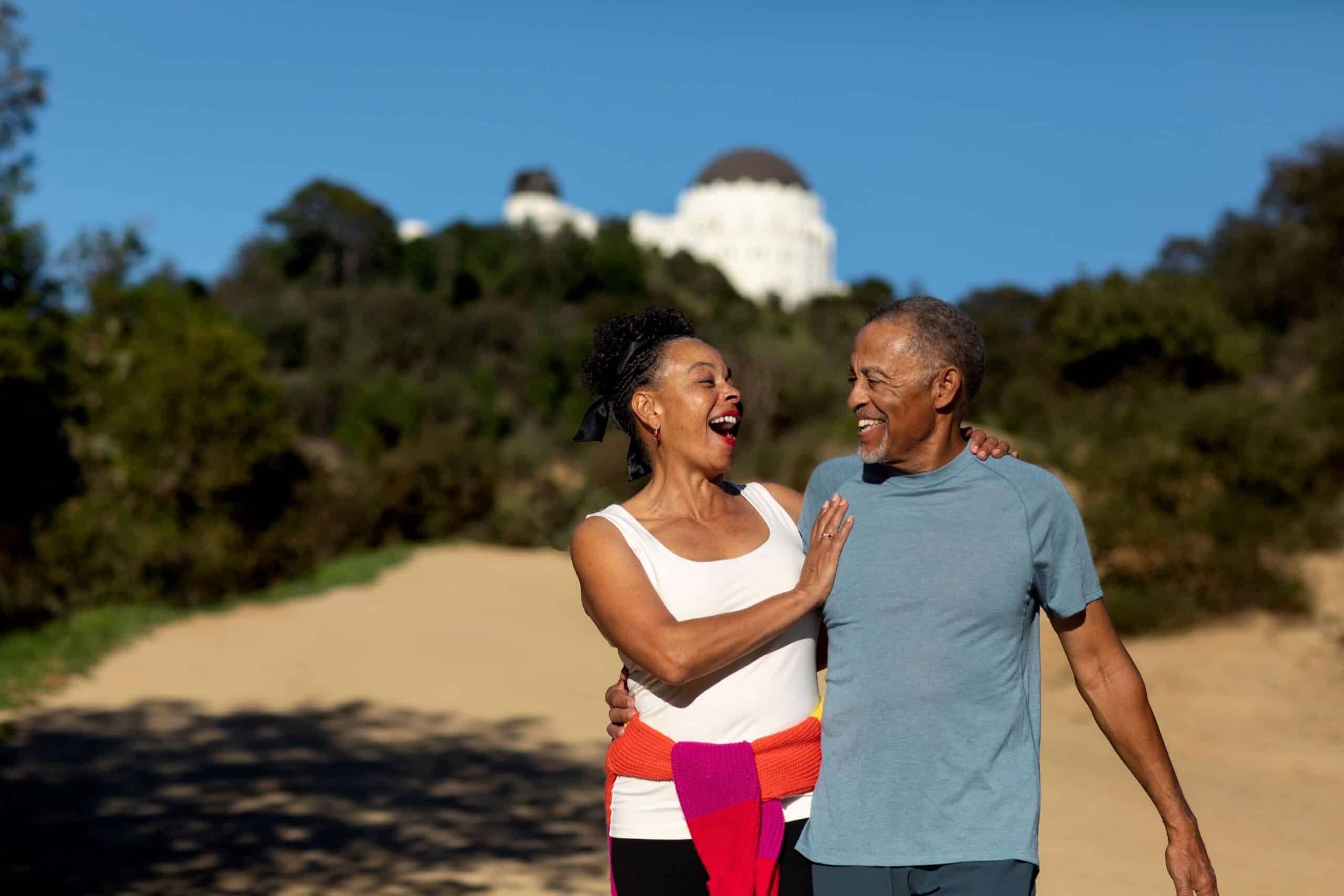 what is the latest treatment for erectile dysfunction, Image of a middle-age couple walking on a dirt path, embracing and smiling at each other.