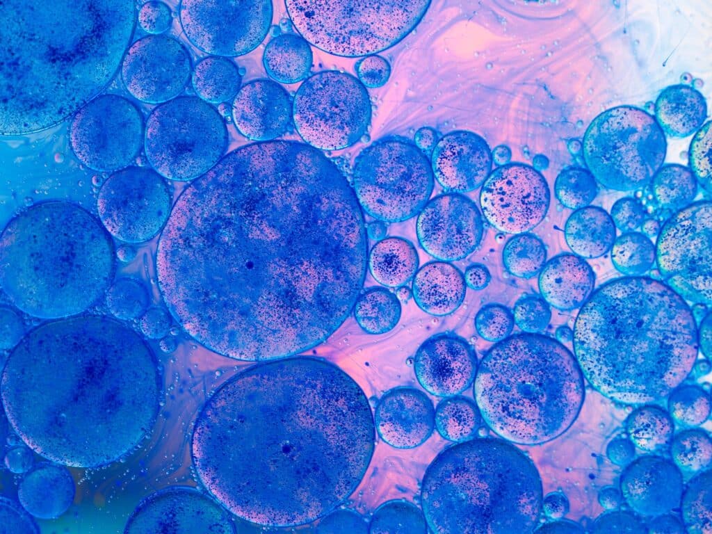 Orthopedic stem cell therapy, image of a microscopic view of blue stem cells.