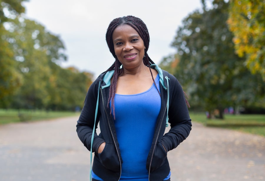 Regenexx Elbow Treatment, image of woman standing and smiling.